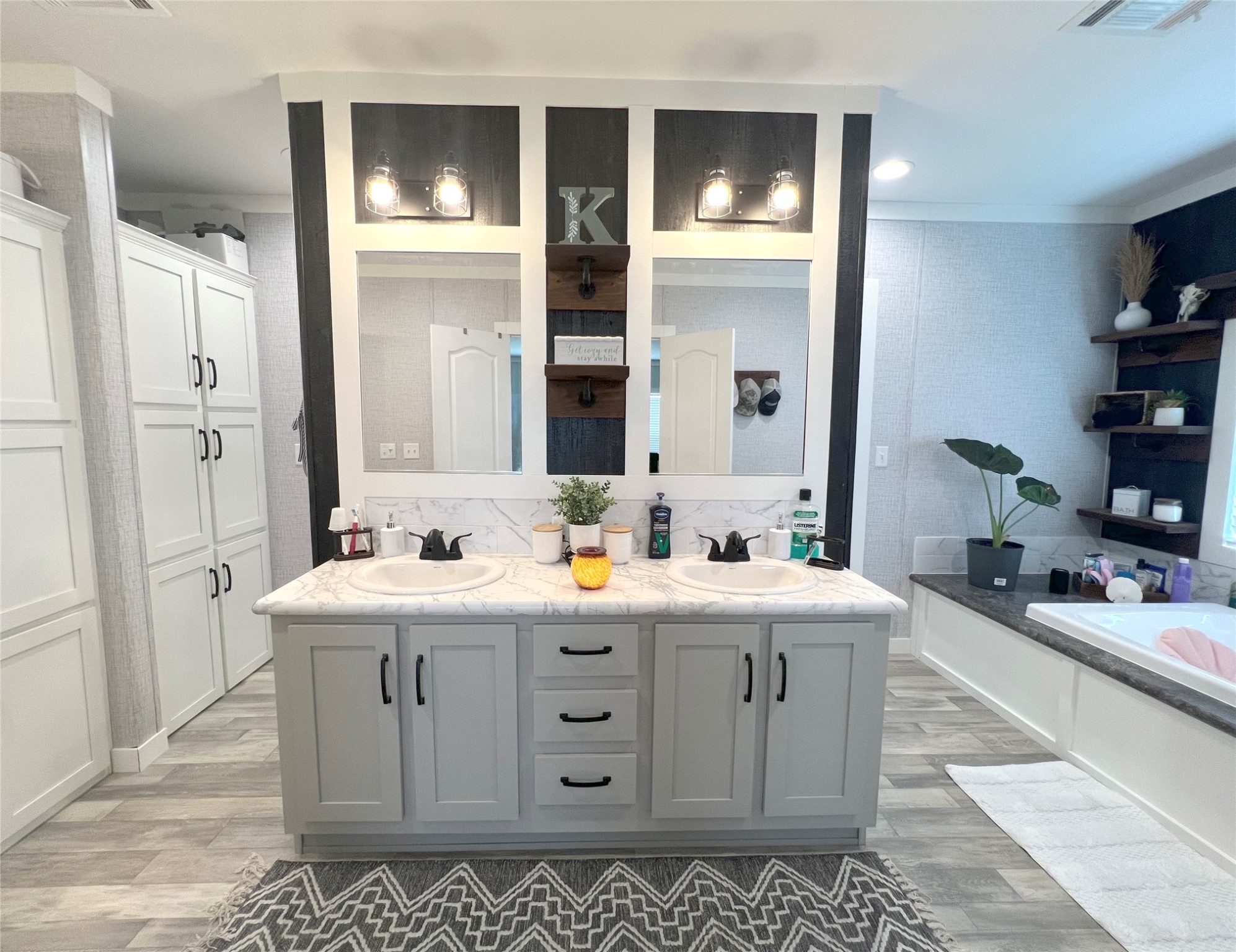 7391 FM 2546 Road El Campo, TX 77437 - Photo 35 of 50 a spacious bathroom with a double vanity sink mirror and