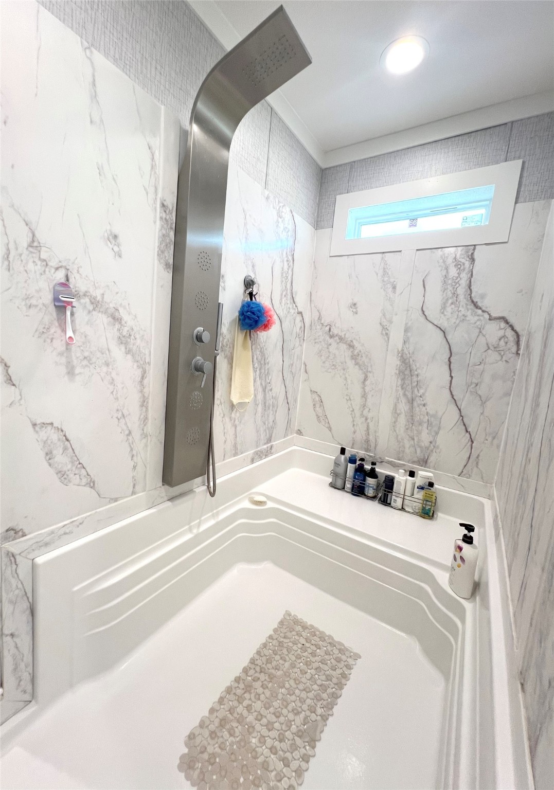 7391 FM 2546 Road El Campo, TX 77437 - Photo 38 of 50 a bathroom with a tub sink and a mirror