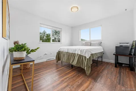 a bedroom with a bed and a table