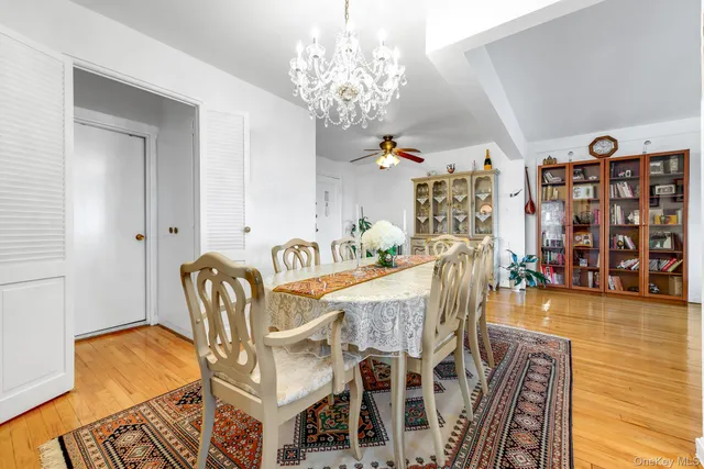 a living room with furniture and a book shelf