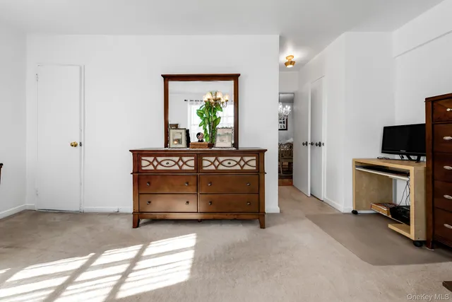 a bathroom with a sink toilet and mirror