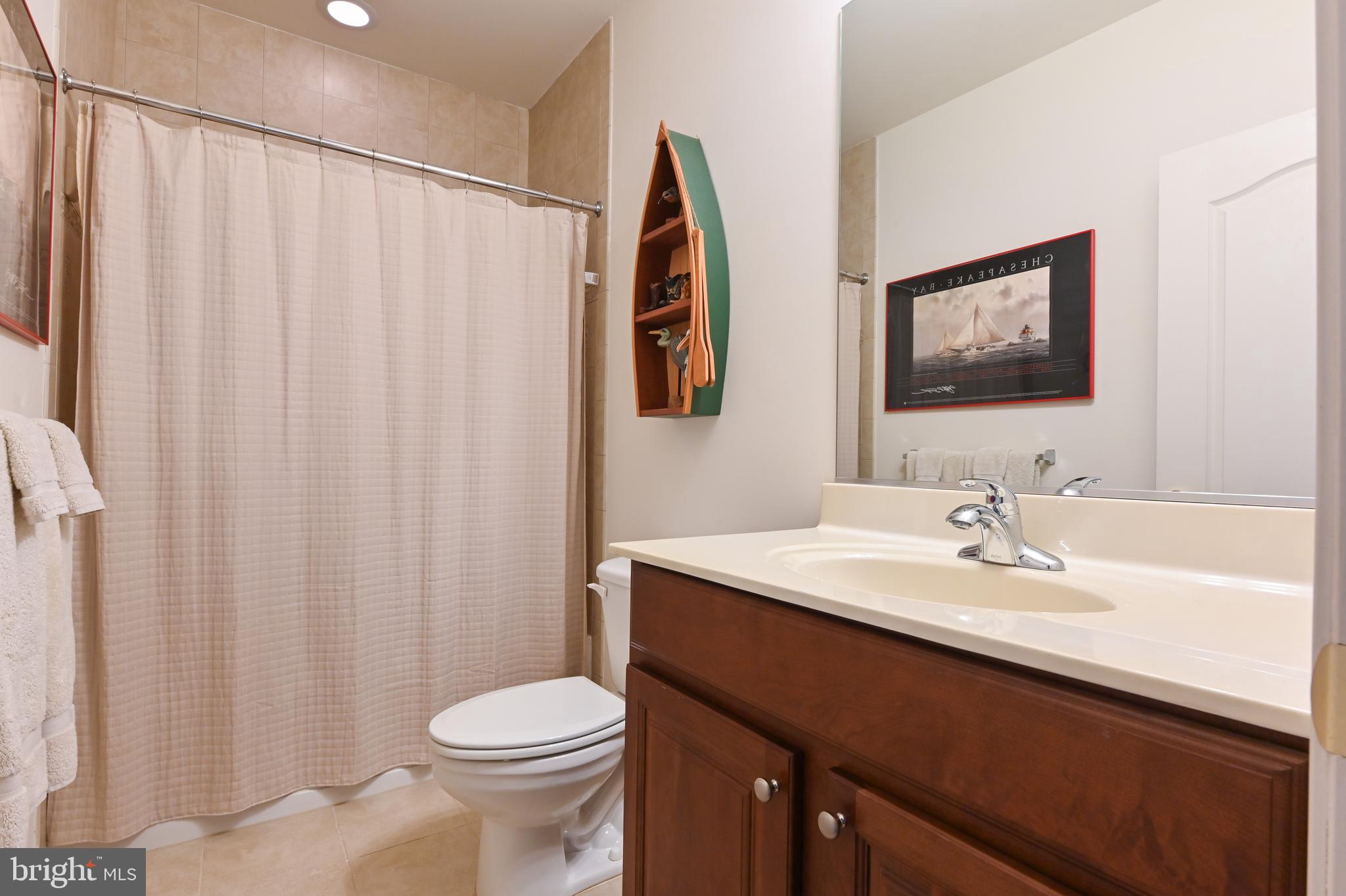 371 Overture Way Centreville, MD 21617 - Photo 41 of 68 a bathroom with a sink toilet and vanity