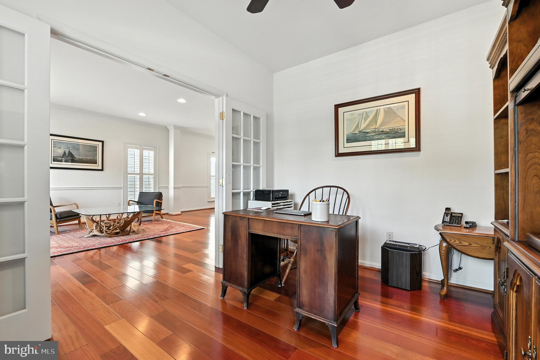 371 Overture Way Centreville, MD 21617 - Photo 7 of 68 a living room with furniture a dining table and wooden floor