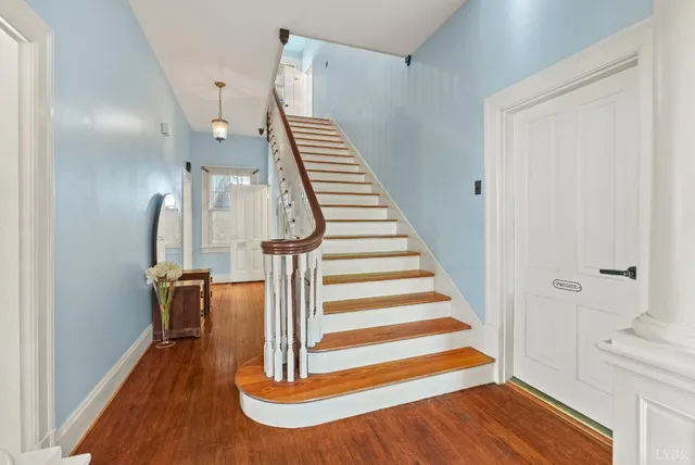 a view of entryway with wooden floor