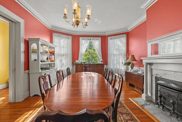 a kitchen with stainless steel appliances granite countertop a stove top oven a sink dishwasher and cabinets with wooden floor