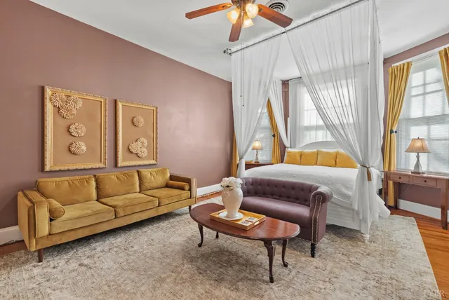 a view of a livingroom with furniture window and wooden floor