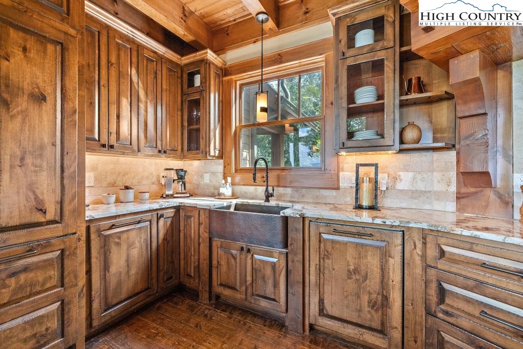 711 Goldenrod Road Boone, NC 28607 - Photo 11 of 49 a kitchen with stainless steel appliances granite countertop a sink and a stove
