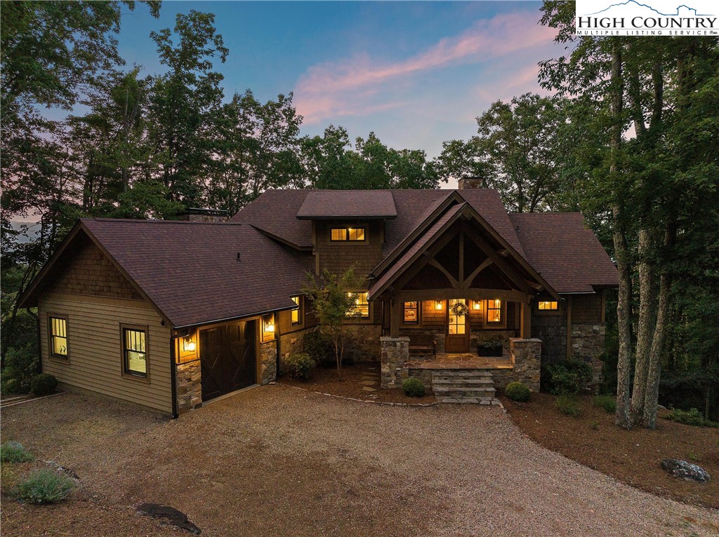 711 Goldenrod Road Boone, NC 28607 - Photo 2 of 49 a front view of a house with a yard and garage