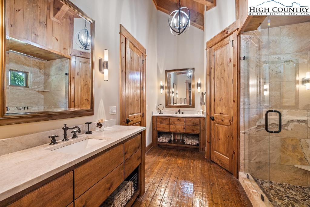 711 Goldenrod Road Boone, NC 28607 - Photo 22 of 49 a bathroom with a granite countertop sink mirror and vanity