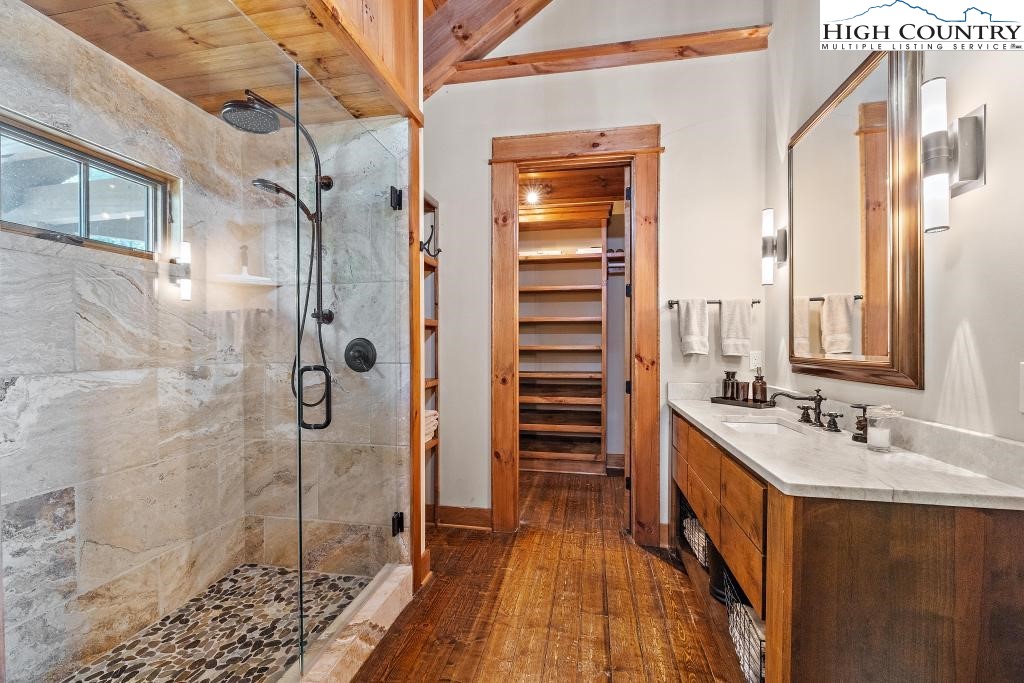 711 Goldenrod Road Boone, NC 28607 - Photo 23 of 49 a bathroom with a double vanity sink a toilet and shower