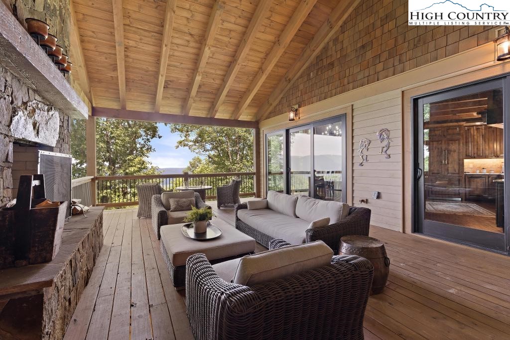 711 Goldenrod Road Boone, NC 28607 - Photo 26 of 49 a living room with furniture and a floor to ceiling window