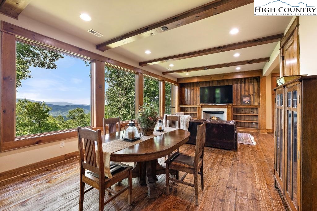 711 Goldenrod Road Boone, NC 28607 - Photo 31 of 49 a dining room with furniture window and wooden floor