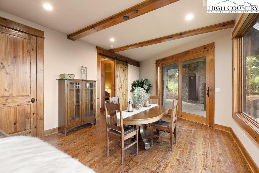 711 Goldenrod Road Boone, NC 28607 - Photo 36 of 49 a view of a dining room with furniture window and wooden floor
