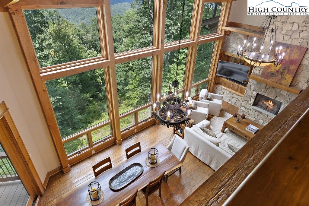 711 Goldenrod Road Boone, NC 28607 - Photo 4 of 49 a living room with furniture and a floor to ceiling window