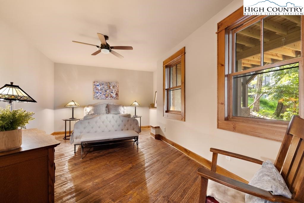 711 Goldenrod Road Boone, NC 28607 - Photo 43 of 49 a bedroom with a bed and wooden floor