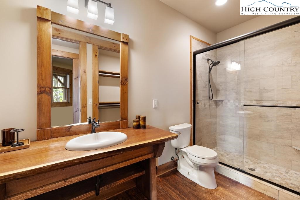 711 Goldenrod Road Boone, NC 28607 - Photo 45 of 49 a bathroom with a sink a toilet and shower