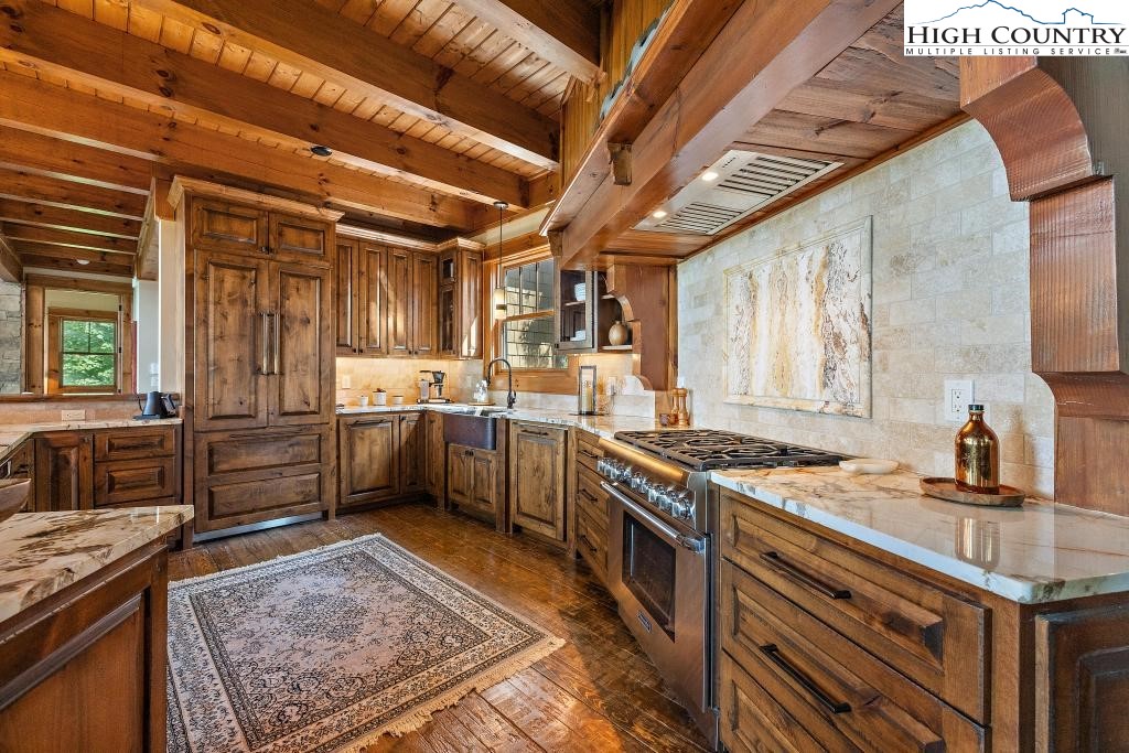 711 Goldenrod Road Boone, NC 28607 - Photo 10 of 49 a kitchen with stainless steel appliances granite countertop a stove a sink and a refrigerator