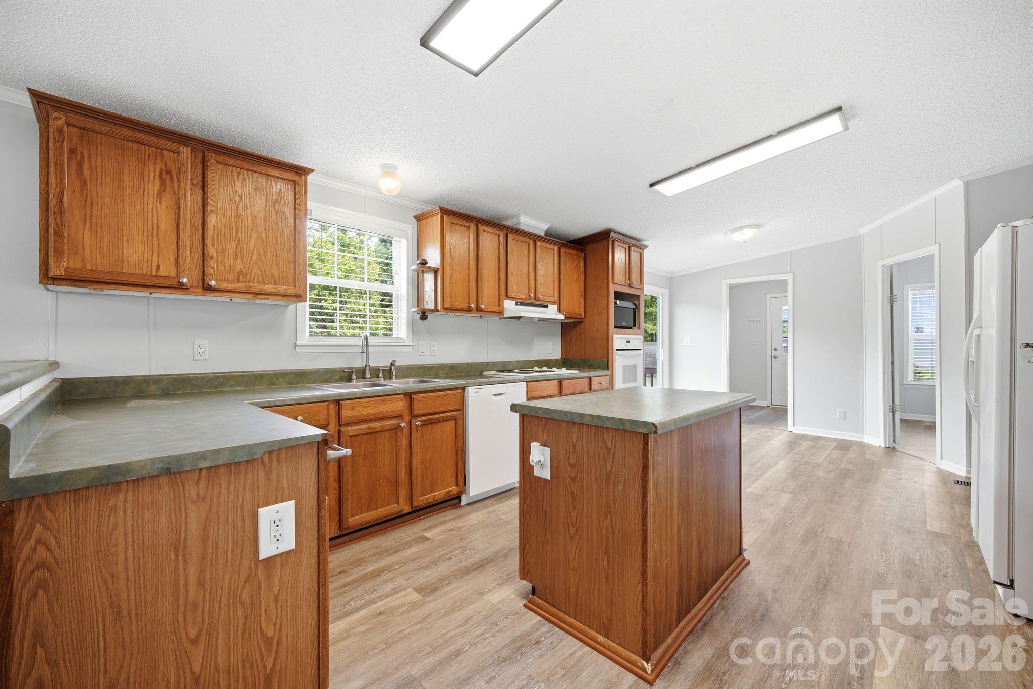2368 Beth Haven Church Road Denver, NC 28037 - Photo 26 of 42 a kitchen with stainless steel appliances granite countertop a sink stove and refrigerator