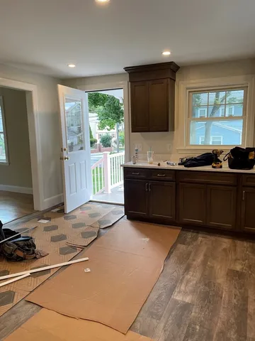 a kitchen with stainless steel appliances a refrigerator and a sink