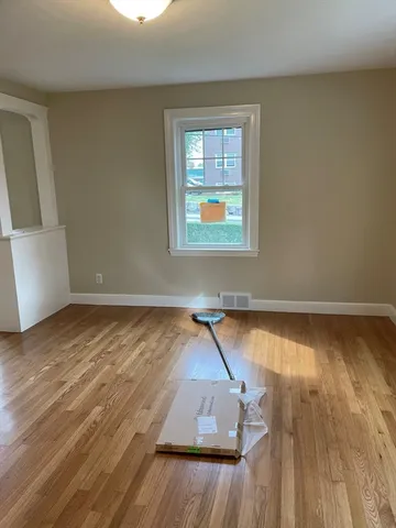 a view of a livingroom with wooden floor