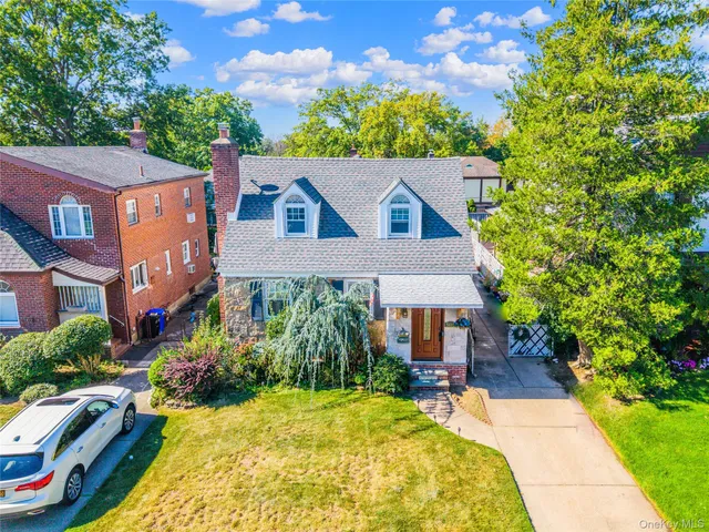 a aerial view of a house with swimming pool