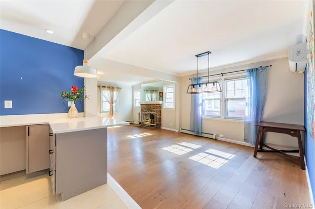 a kitchen with a stove a sink and a microwave