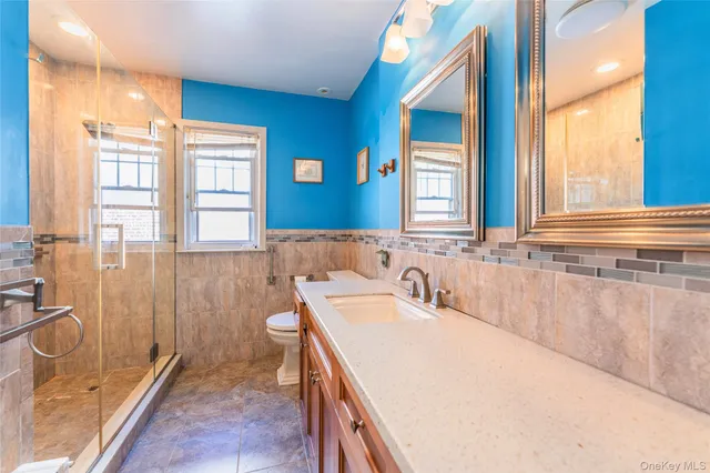 a kitchen with counter top space and living room
