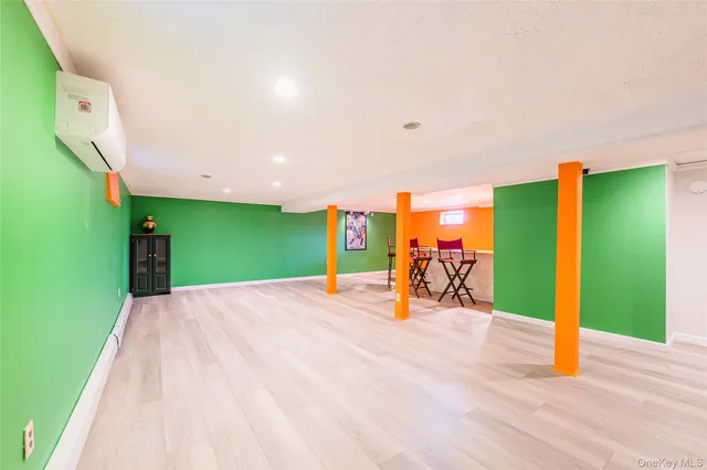 a view of a room with wooden floor and fence