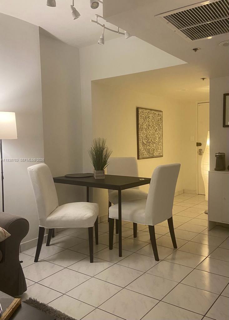 100 Lincoln Road, Unit 314A Miami Beach, FL 33139 - Photo 11 of 40 a view of a dining room with furniture and a table
