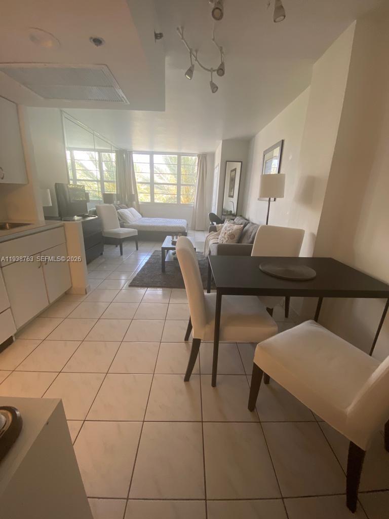 100 Lincoln Road, Unit 314A Miami Beach, FL 33139 - Photo 12 of 40 a living room with furniture and a table