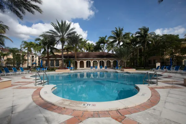a view of a swimming pool with a sitting space