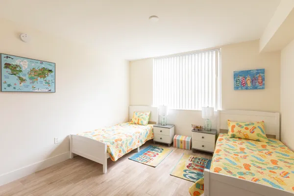 a bedroom with a bed and a couch