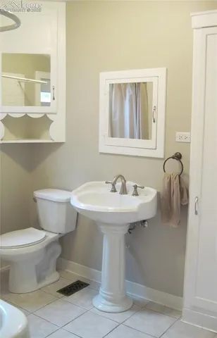 a bathroom with a shower and a bath tub