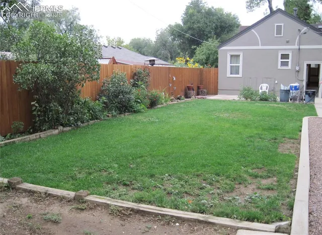 a view of backyard with green space