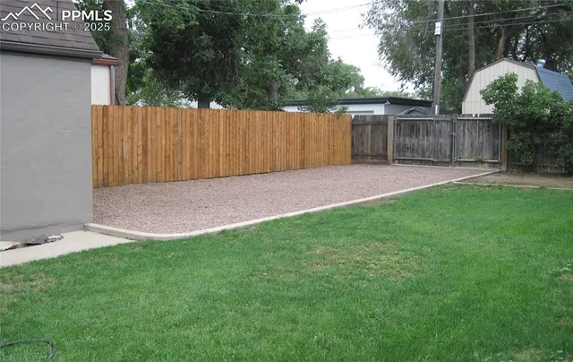 a picture of a bench in front of a building