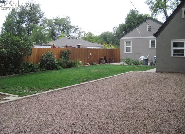 a picture of a bench in front of a wall
