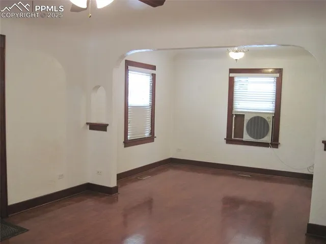 an empty room with windows