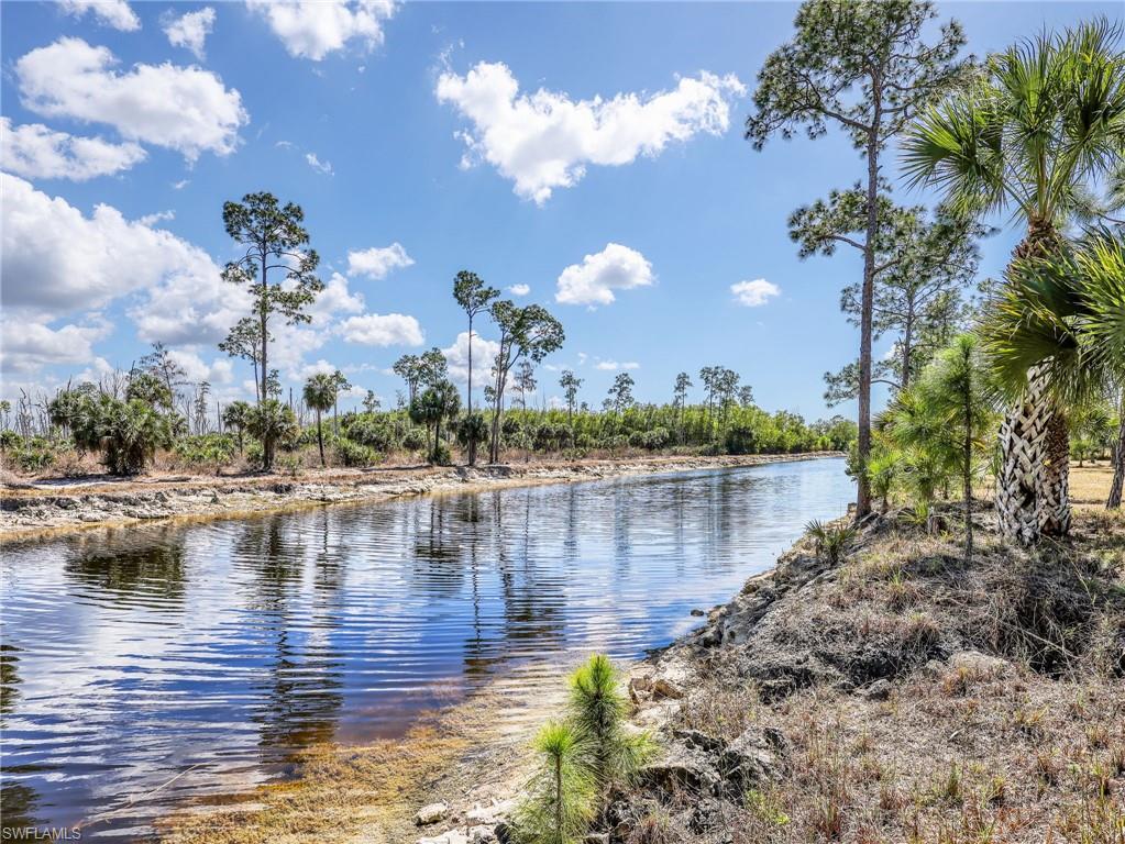 3160 27th Avenue Southwest Naples, FL 34117 - Photo 39 of 43 a view of a lake with houses