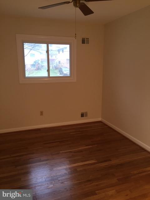 3919 Ilford Road Silver Spring, MD 20906 - Photo 22 of 32 a view of a room with wooden floor and window