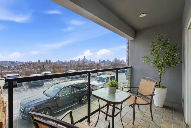 a terrace with outdoor seating and city view