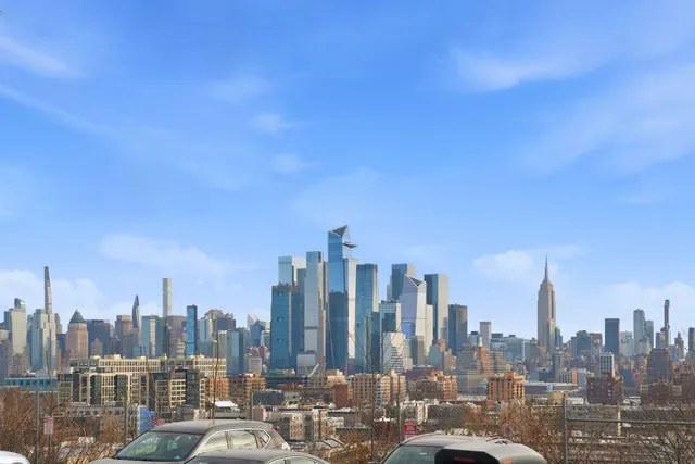 a view of a city with tall buildings in the background