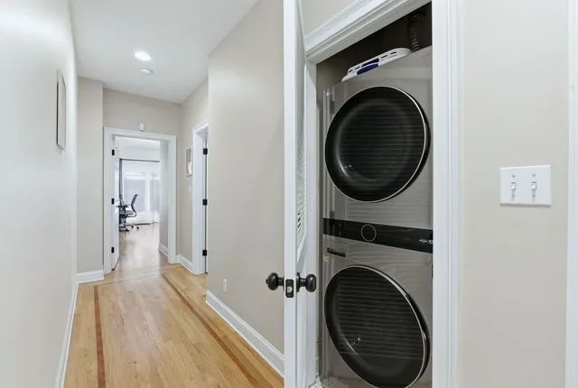 a view of a hallway with washer and dryer