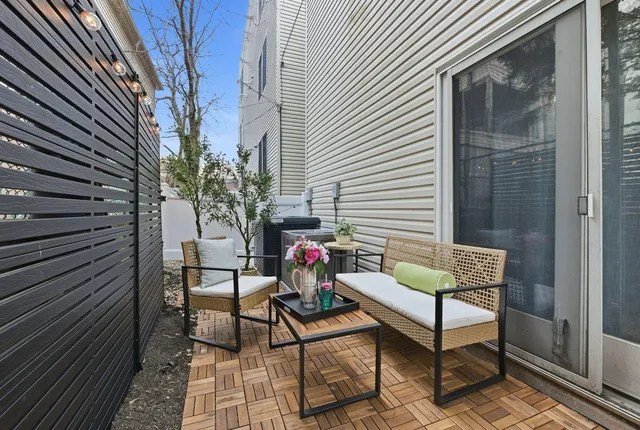 a view of a chairs with a bench in the balcony