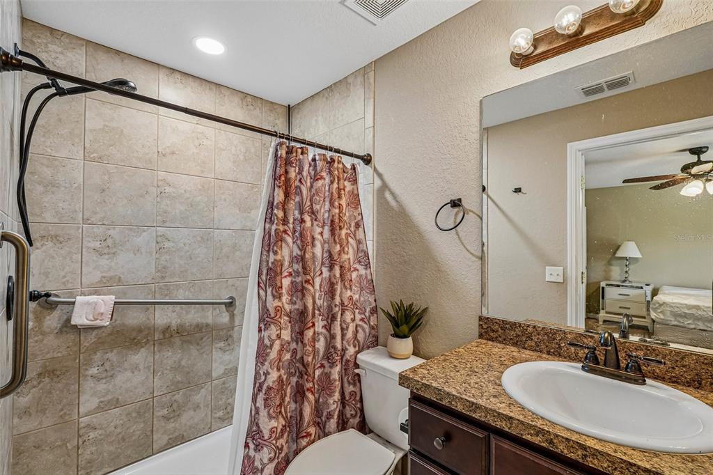 72 Cedar Road Ocala, FL 34472 - Photo 12 of 20 a bathroom with a sink toilet and shower