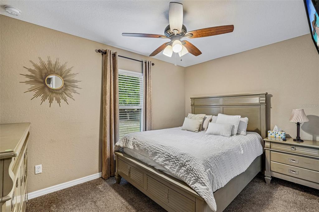 72 Cedar Road Ocala, FL 34472 - Photo 13 of 20 a bedroom with a bed and a chandelier