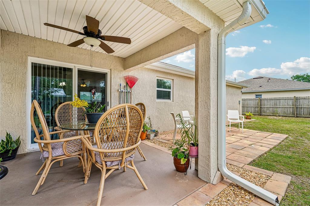 72 Cedar Road Ocala, FL 34472 - Photo 16 of 20 a view of a patio with a table and chairs