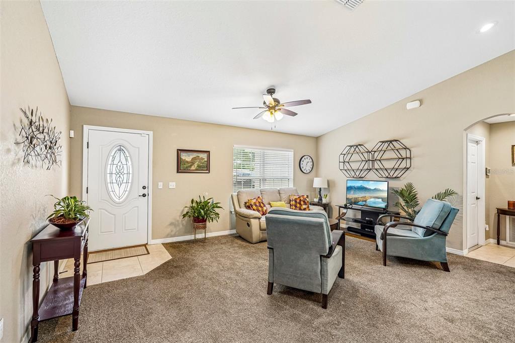 72 Cedar Road Ocala, FL 34472 - Photo 4 of 20 a living room with furniture and a chandelier