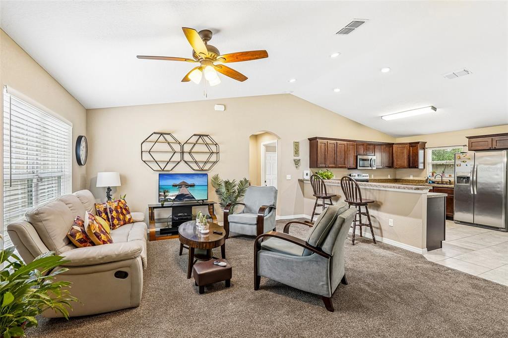 72 Cedar Road Ocala, FL 34472 - Photo 5 of 20 a living room with furniture kitchen view and a large window