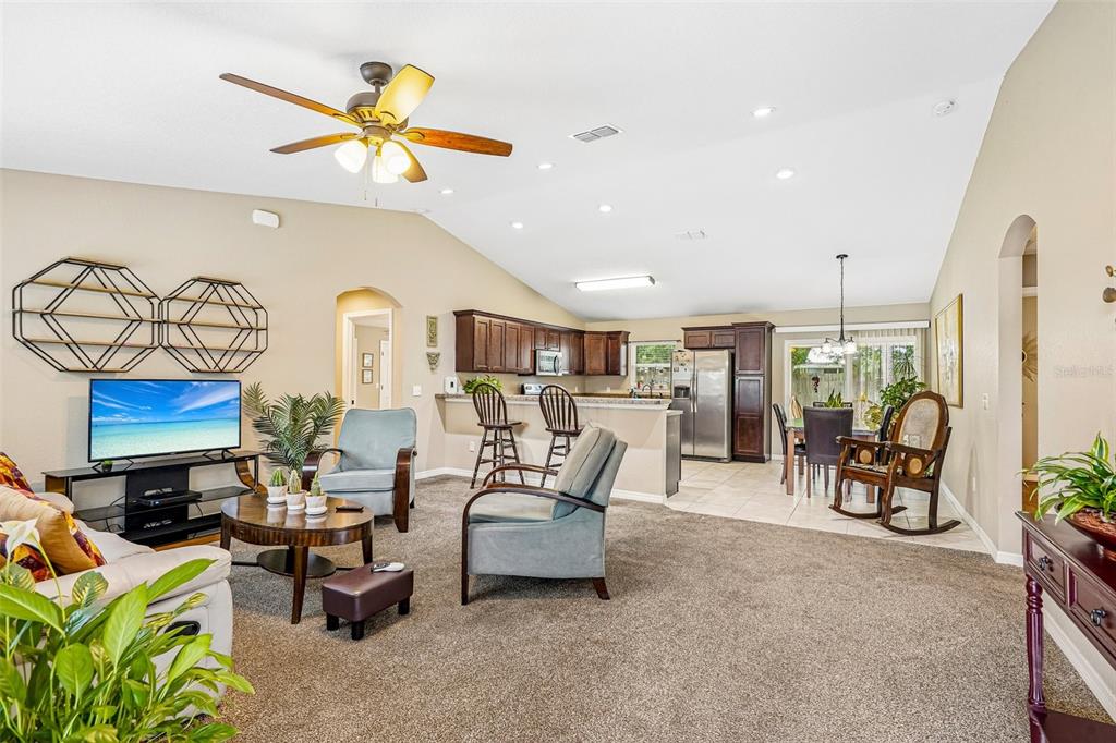 72 Cedar Road Ocala, FL 34472 - Photo 6 of 20 a living room with furniture and a chandelier