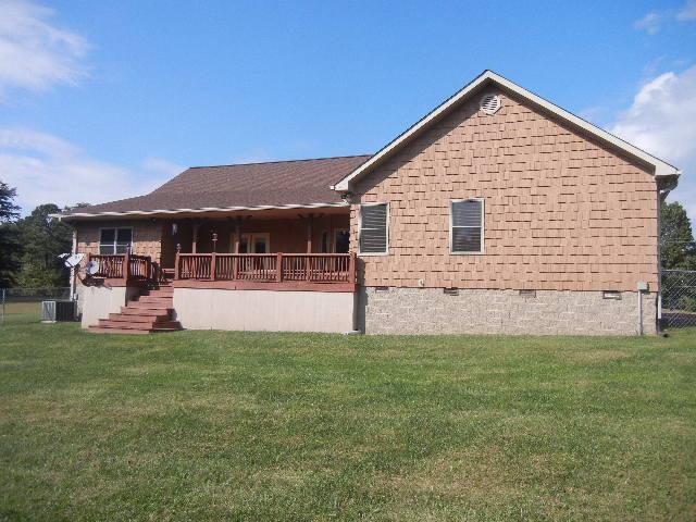 12466 Highway 108 Altamont, TN 37301 - Photo 18 of 20 A Rear View shows the partially covered deck and a crawl space tall enough for even more storage.